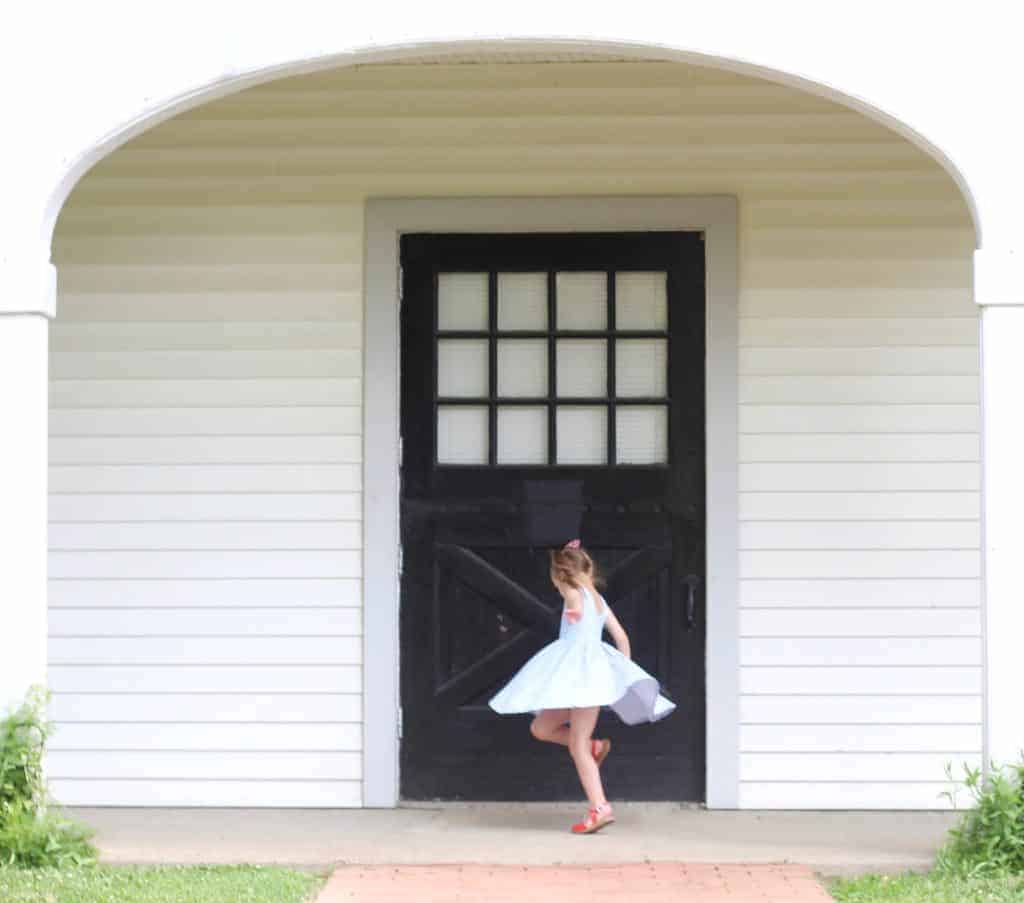 little girl spins in dress