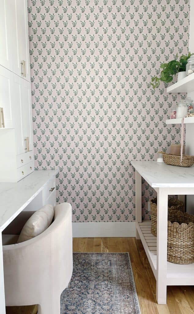 Pink and green vintage inspired wallpaper in small home office 