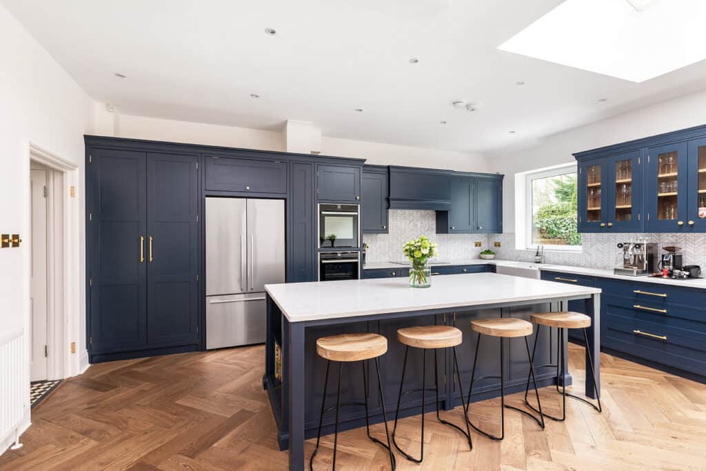 varying cabinet depth in blue kitchen