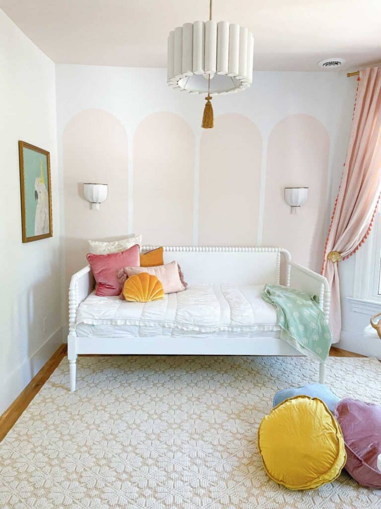 room with pink arches