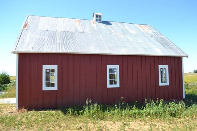 red barn with white windows