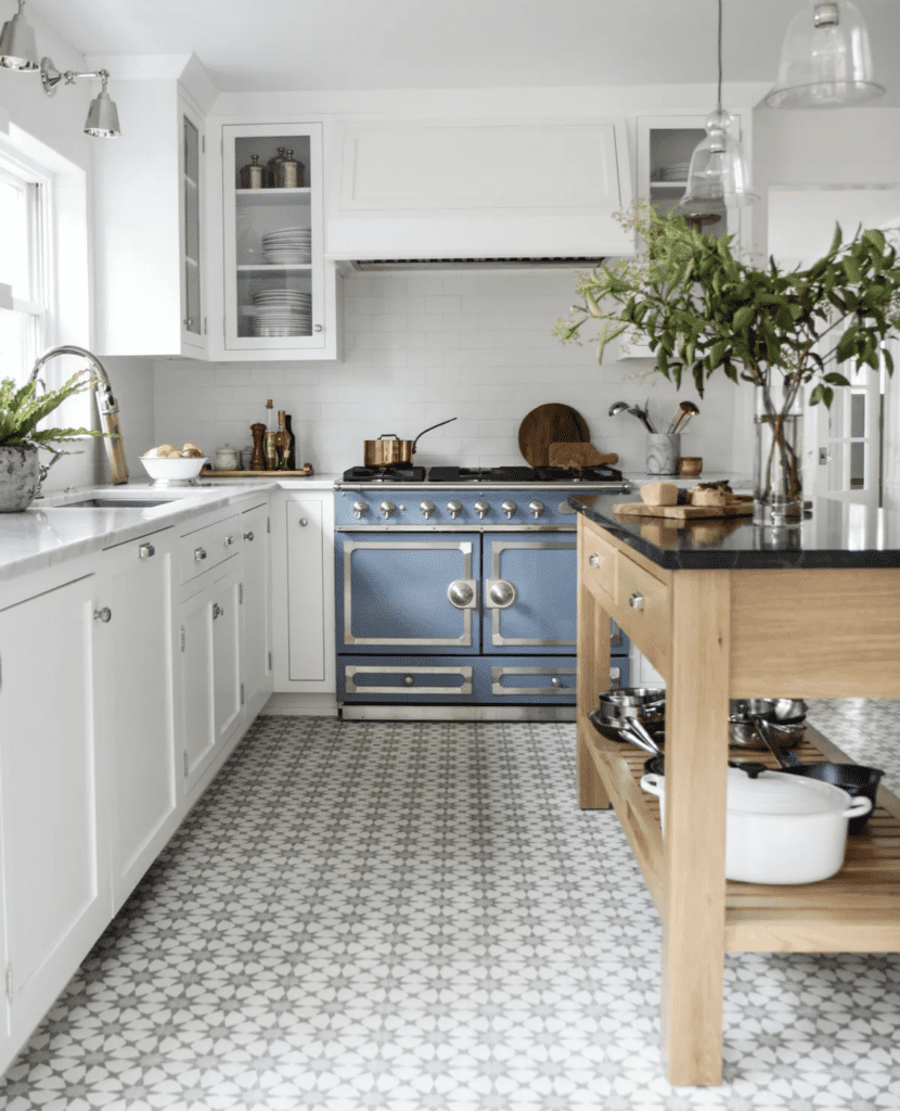 eclectic kitchen with glass upper cabinets