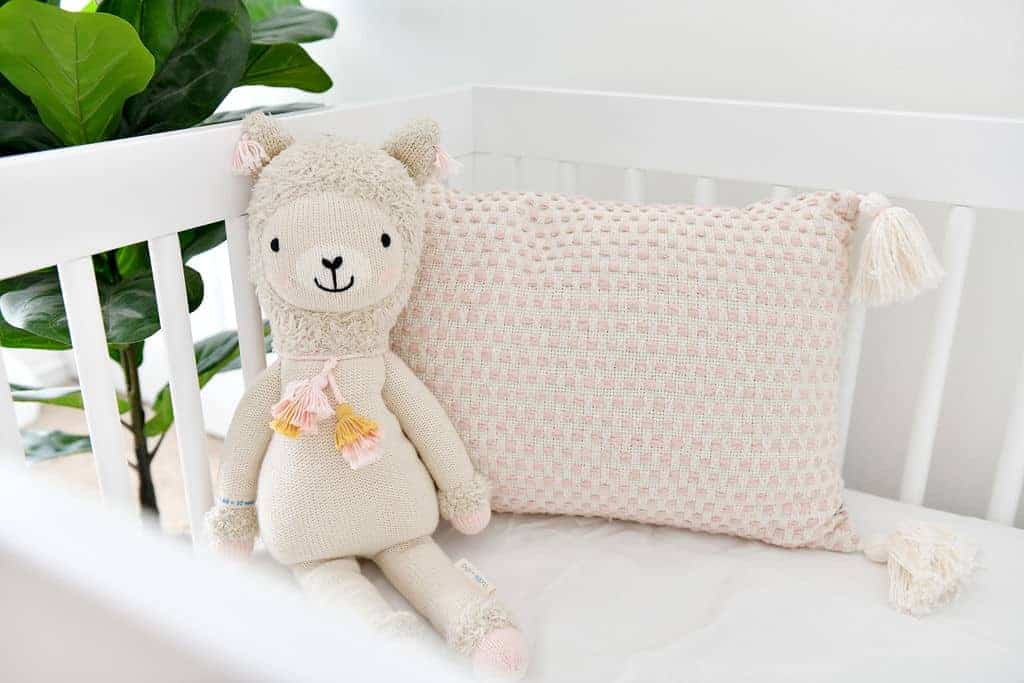 baby crib with stuffed animals