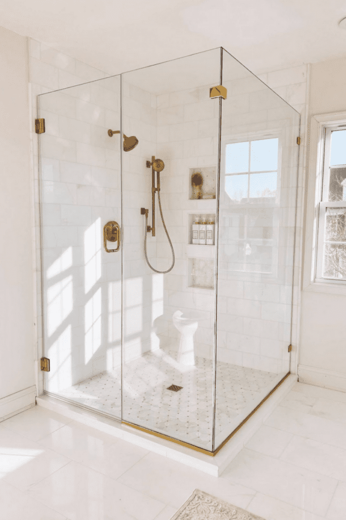 Marble shower wall in neutral bathroom