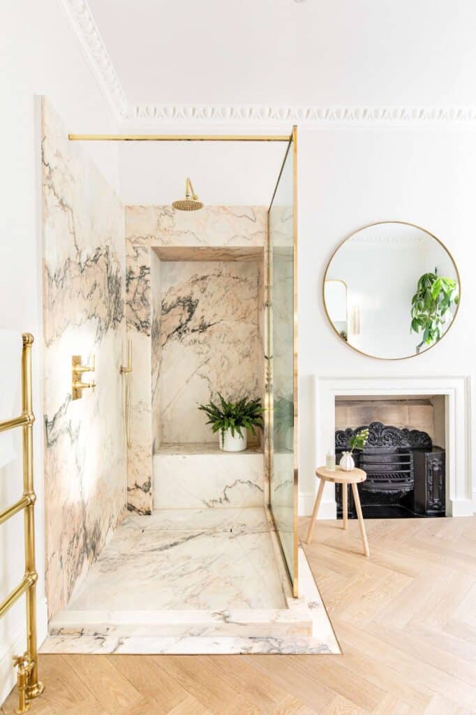 pink marble shower in feminine bathroom