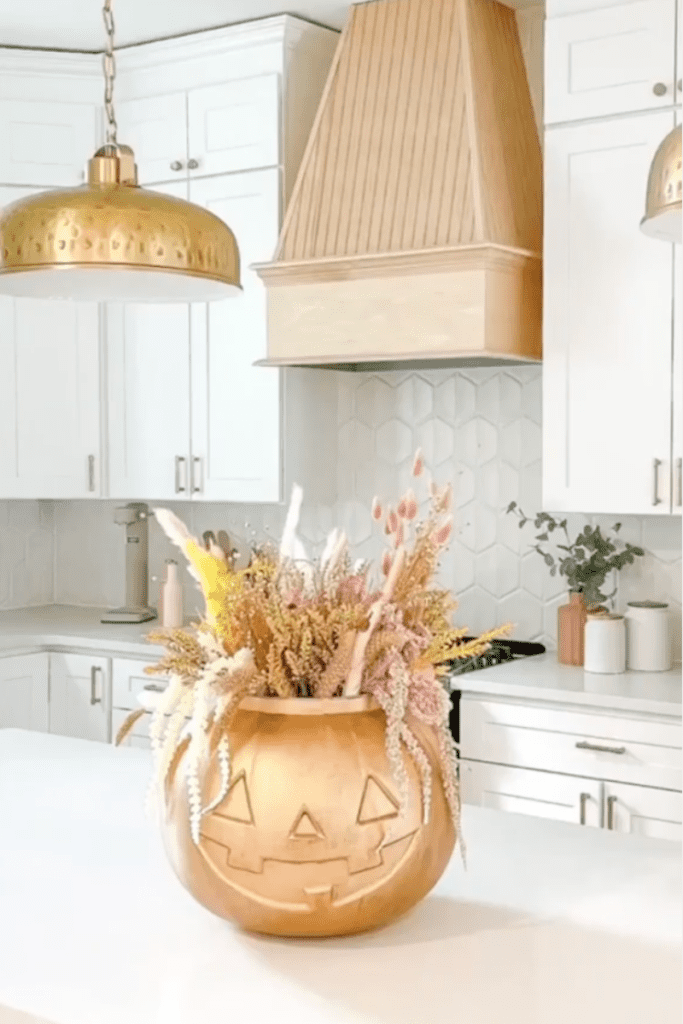 gold pumpkin vase with fall florals