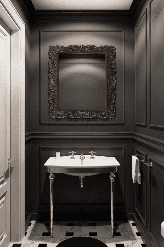 black powder room with picture molding