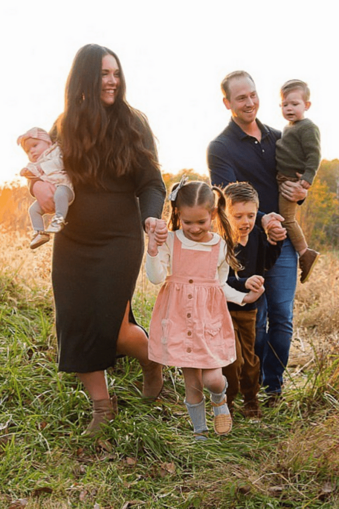 family in field in fall