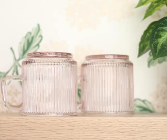 Pink Glass Mugs on Wood Shelves
