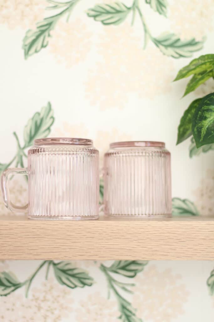 Pink Glass Mugs on Wood Shelves