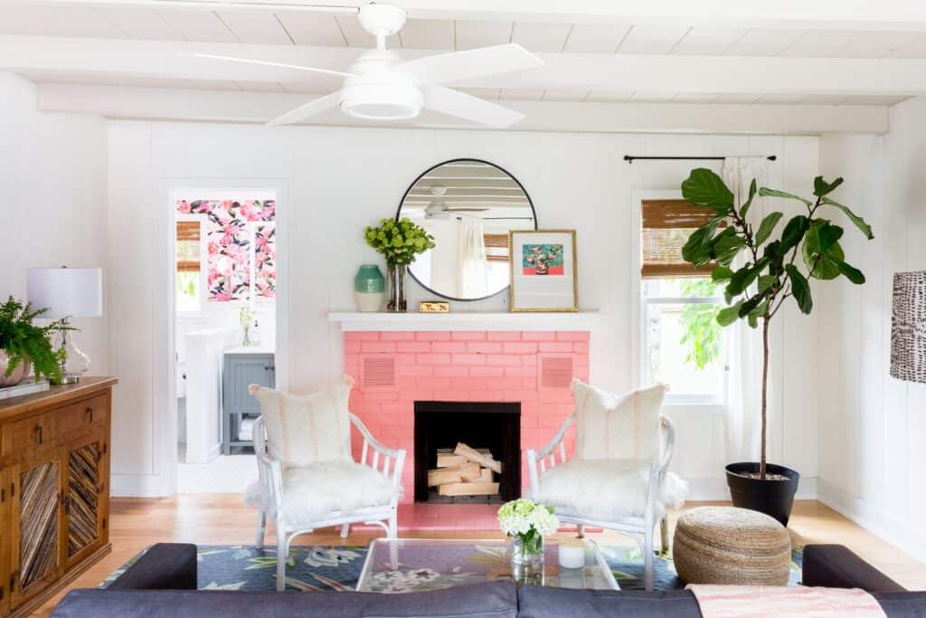 Painting stone fireplace ideas with a modern pink painted fireplace