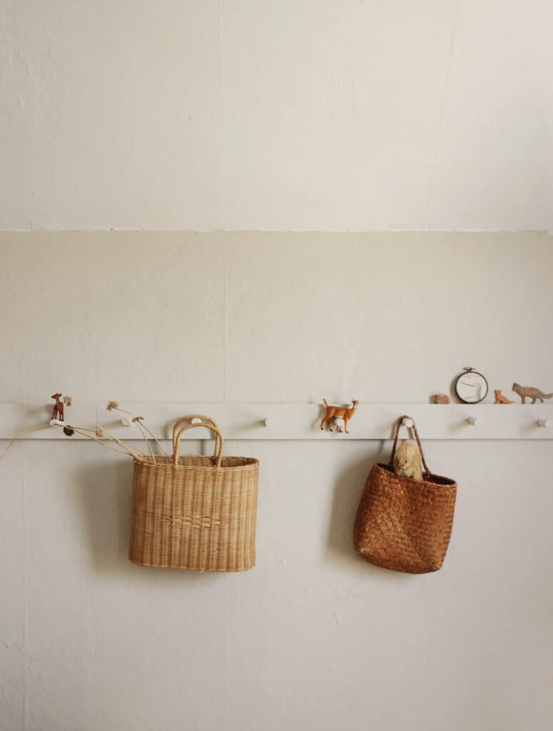 Peg board with hanging baskets.