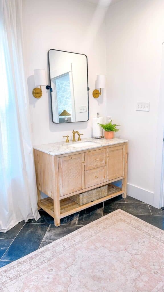 Natural wood bathroom vanity.