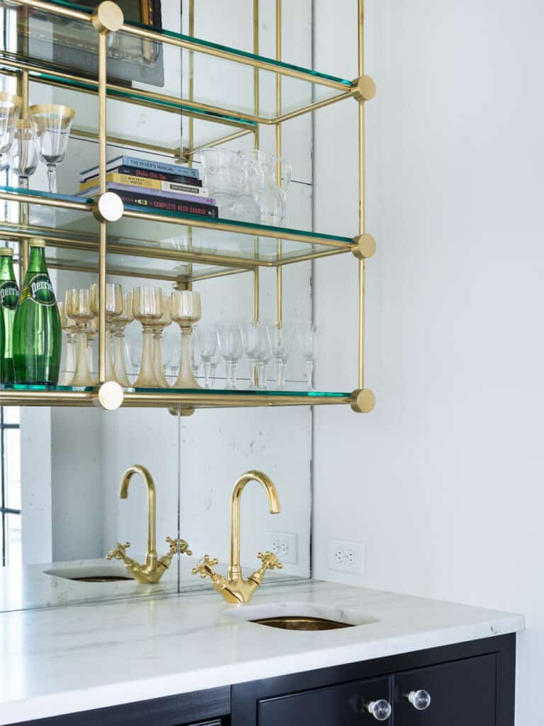 Glass wet bar with gold accents.