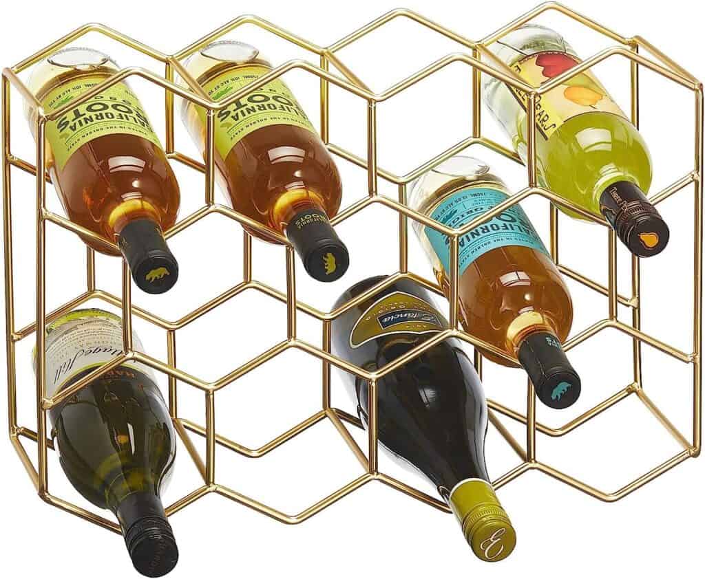 Brass or gold honeycomb looking wine storage as a water bottle storage.