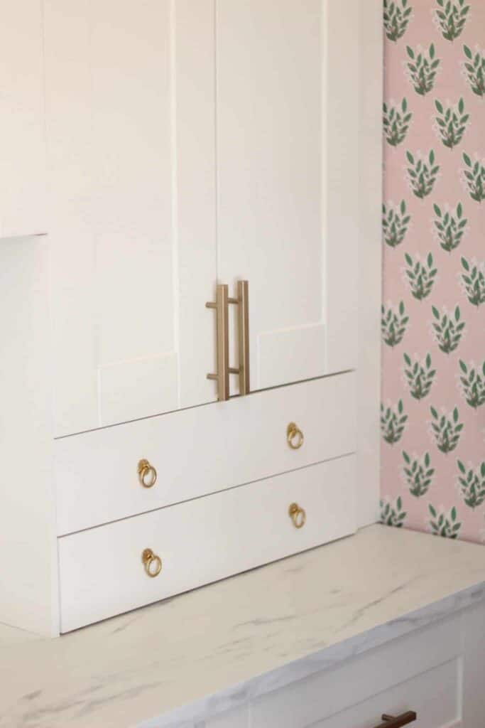 Office cabinets in white and brass hardware.