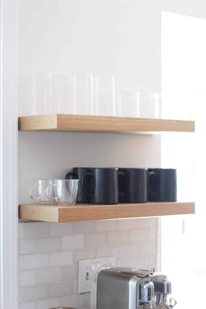Floating shelves in kitchen with glassware.