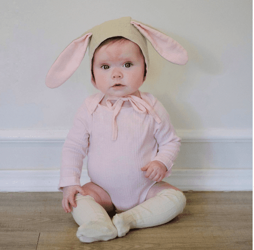 Baby dressed as a bunny.