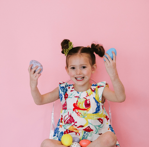 Little girl with Easter eggs.