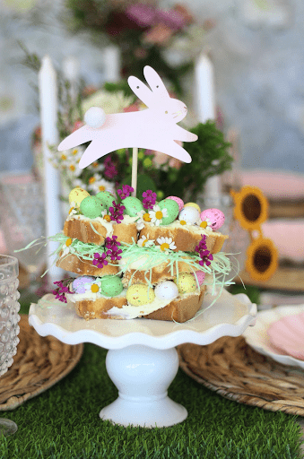 Easter egg cake with chamomile and a bunny cake topper.