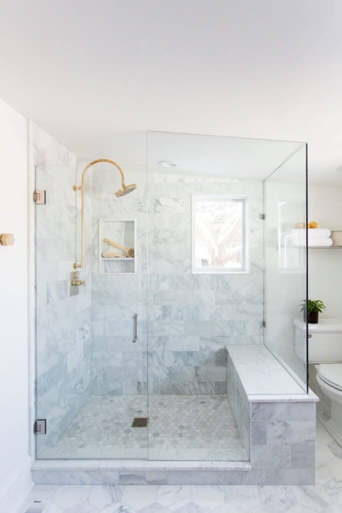 White and grey natural marble shower.