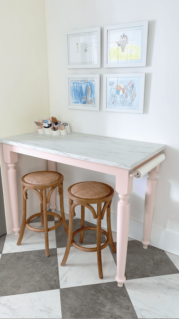 Art table, paper roll, and wicker stools.