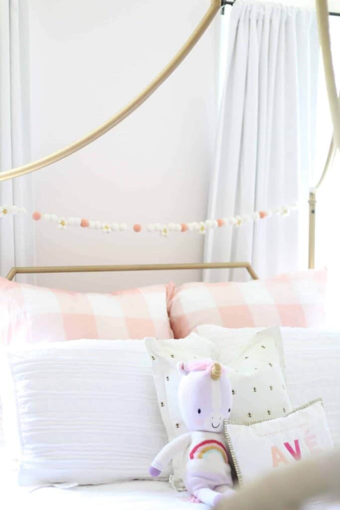 Bedding with pink and white details.