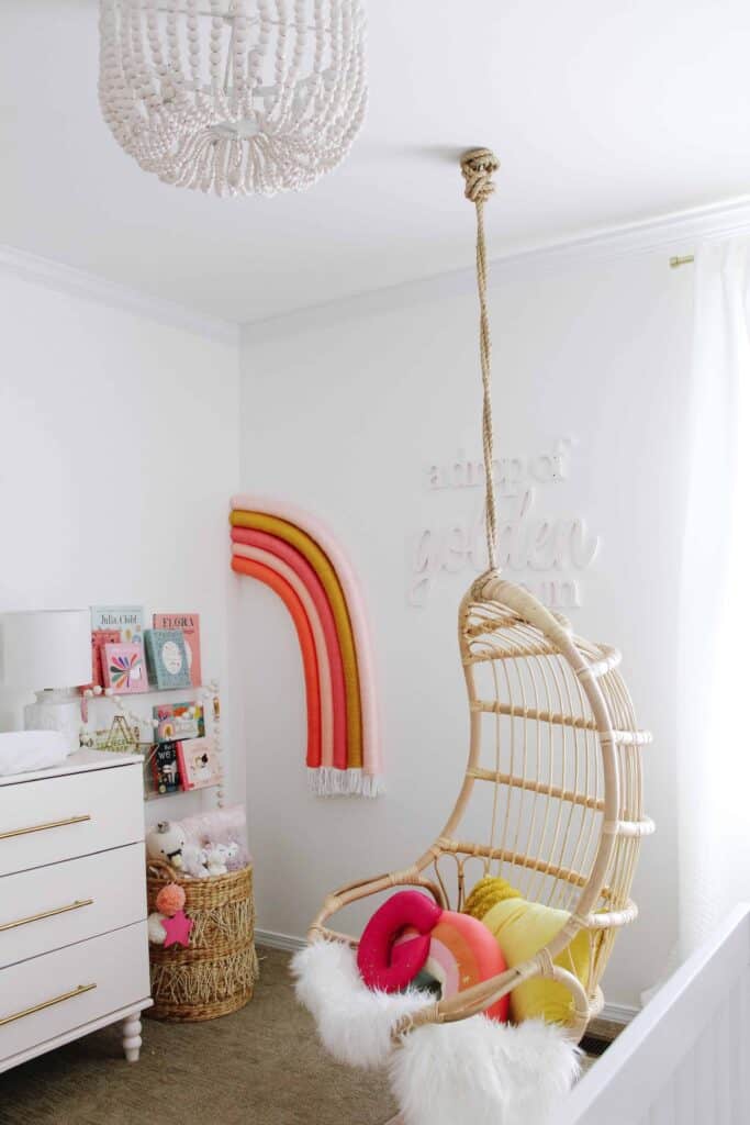 DIY Rainbow art and swing in girls bedroom.