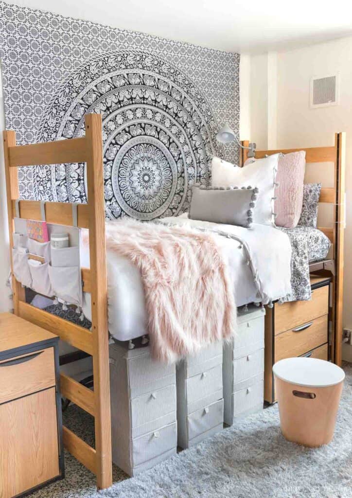 College dorm room with a large medallion wall hanging.