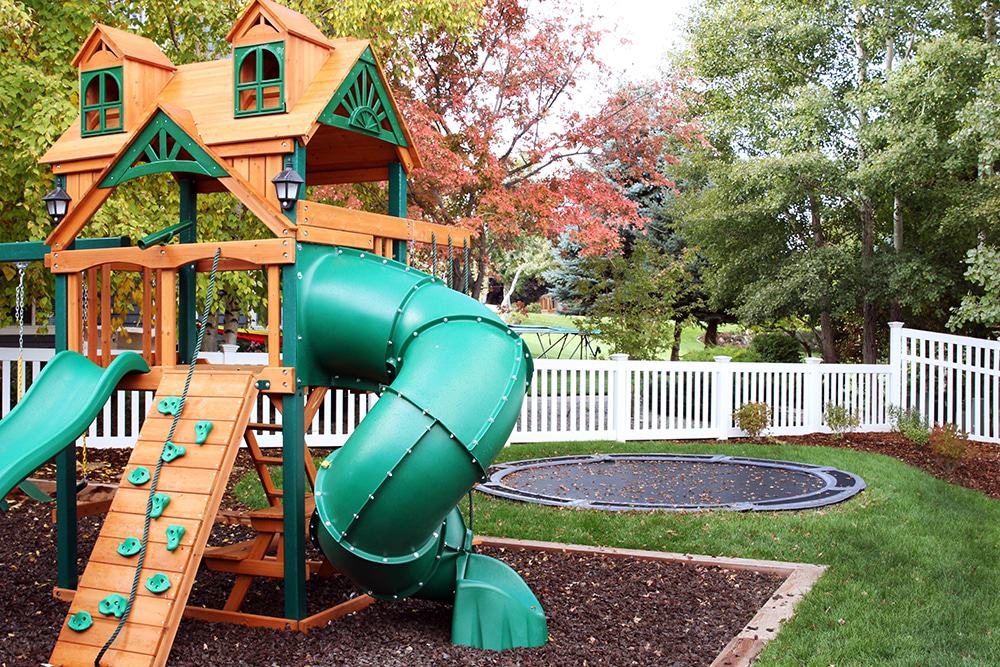 This backyard trampoline is perfect for a small yard with playset.