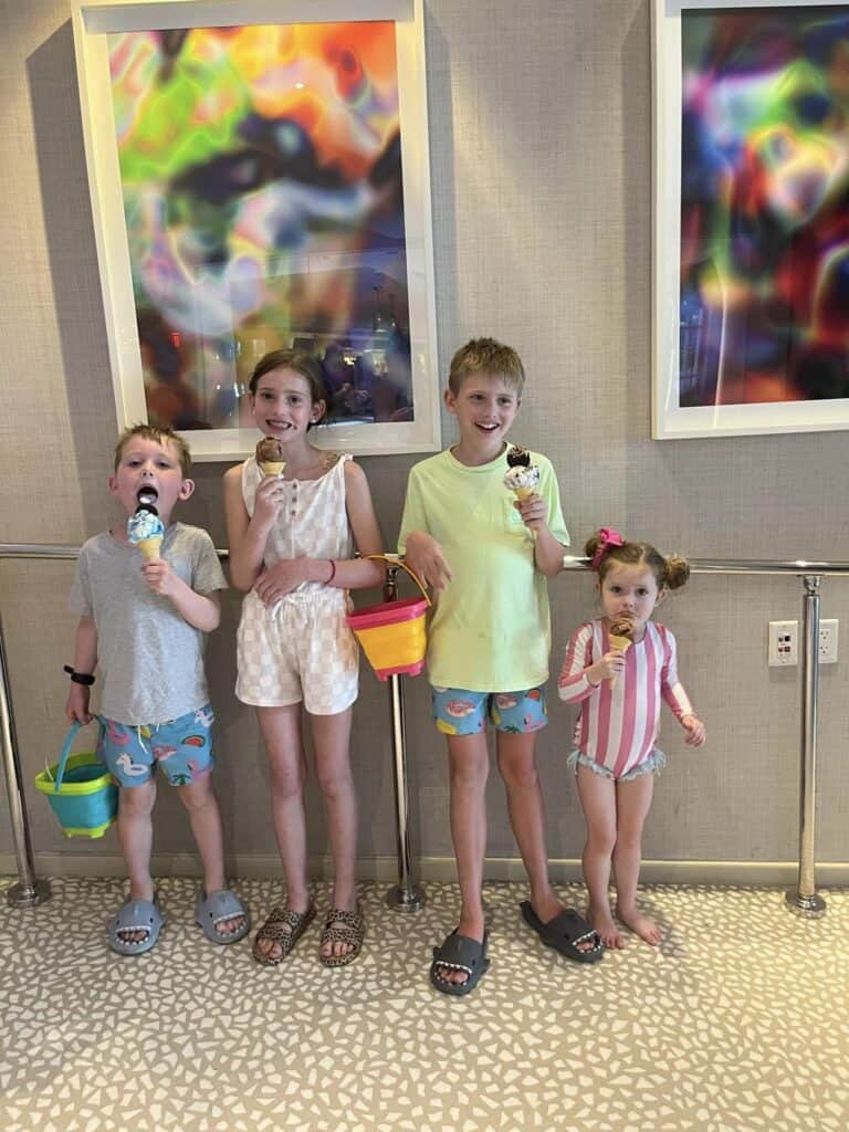 Four kids eating ice cream.