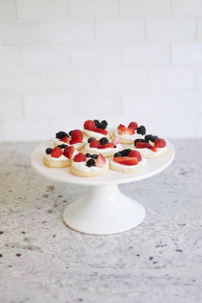 Red white and blue cookies on a cake stand