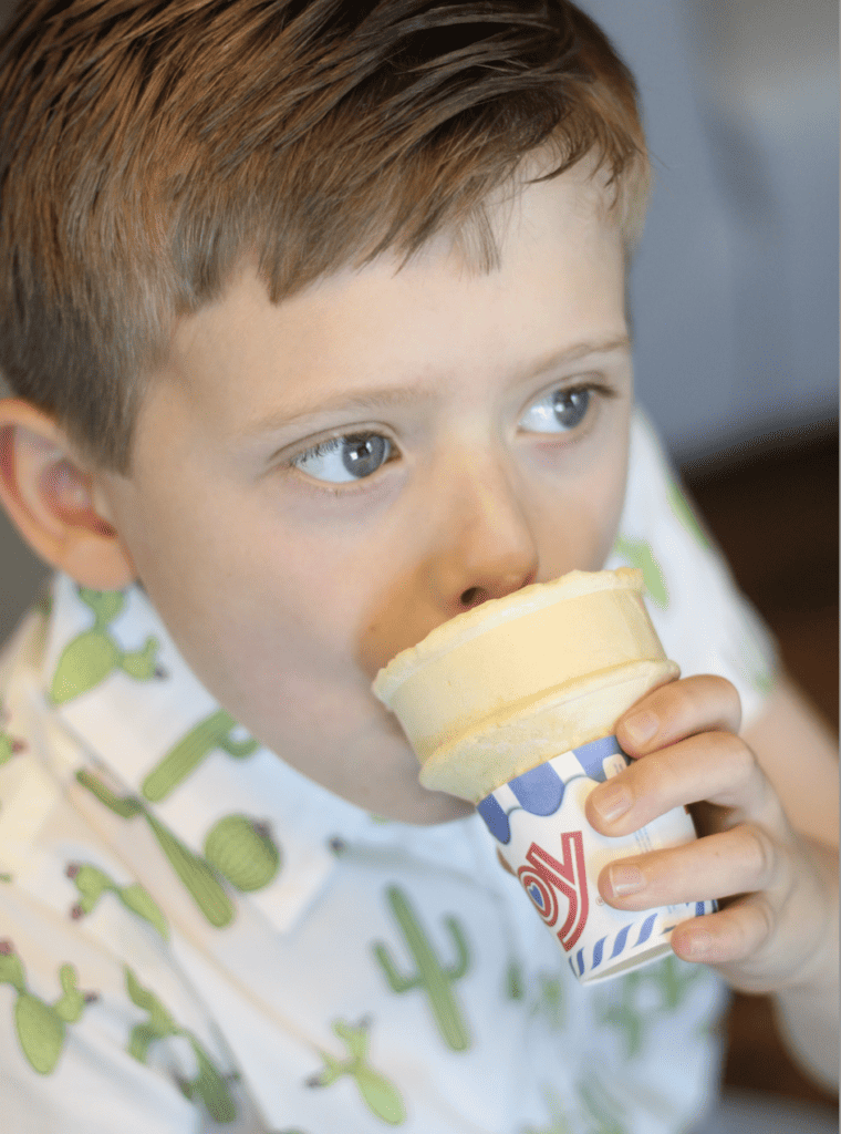 Little boy eating ice cream cone