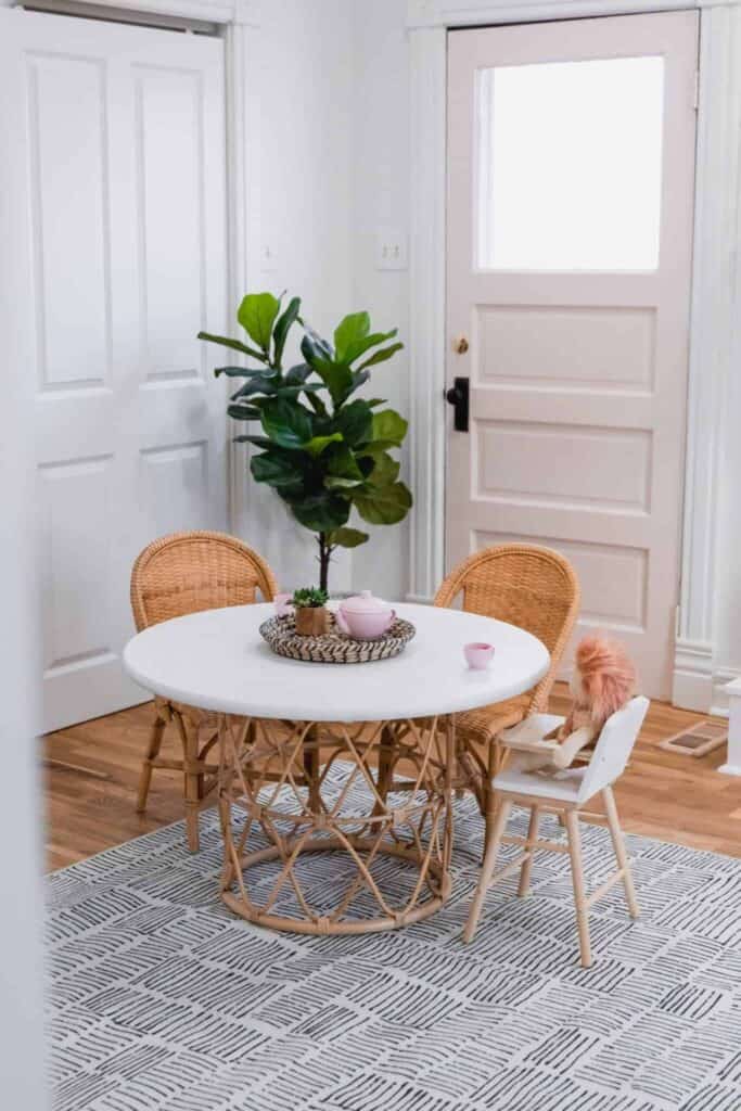 A round table with tray and florals for everyday table centerpiece ideas.