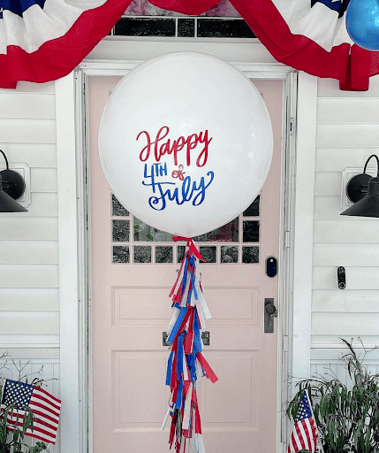4th of July Balloon decor on a porch.