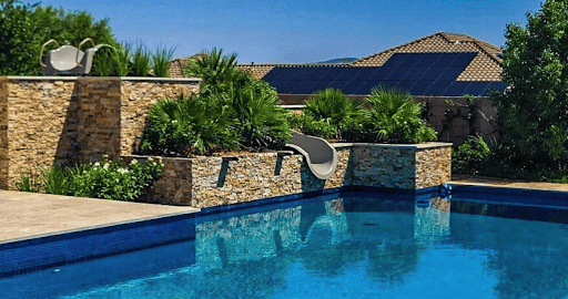 A luxury backyard pool with hidden slide.