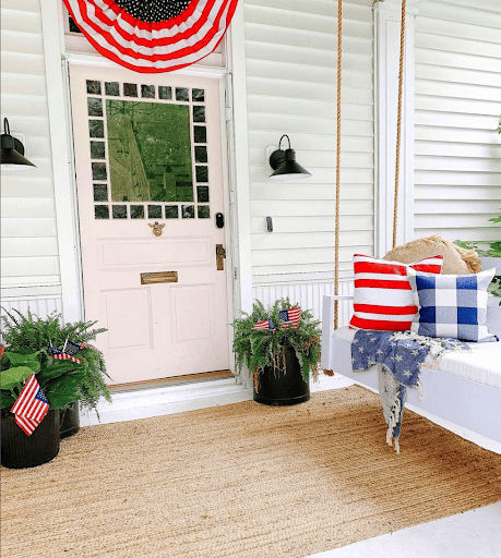 Patriotic porch with red, white, and blue decor