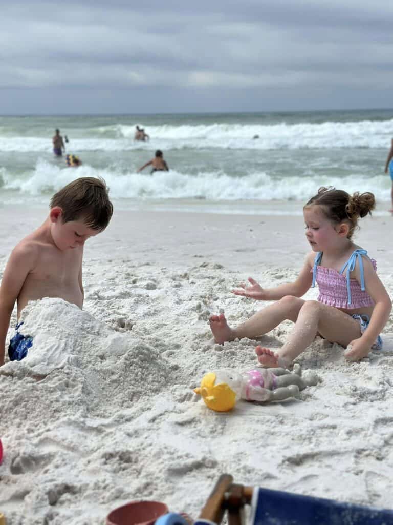 Kids playing in the sand at beach