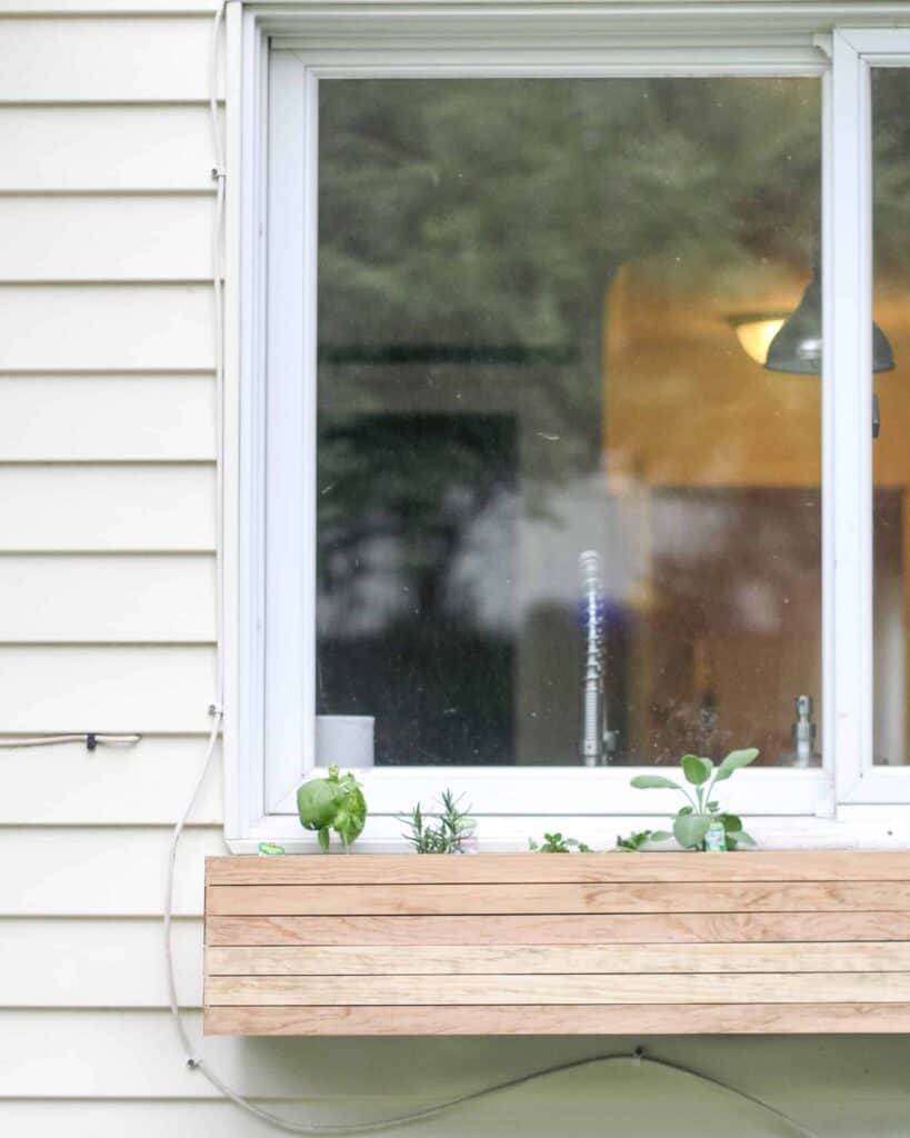 Planter box in window for a great modern outdoor patio ideas on a budget that is a diy