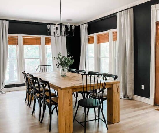 Large DIY dining table with black chairs