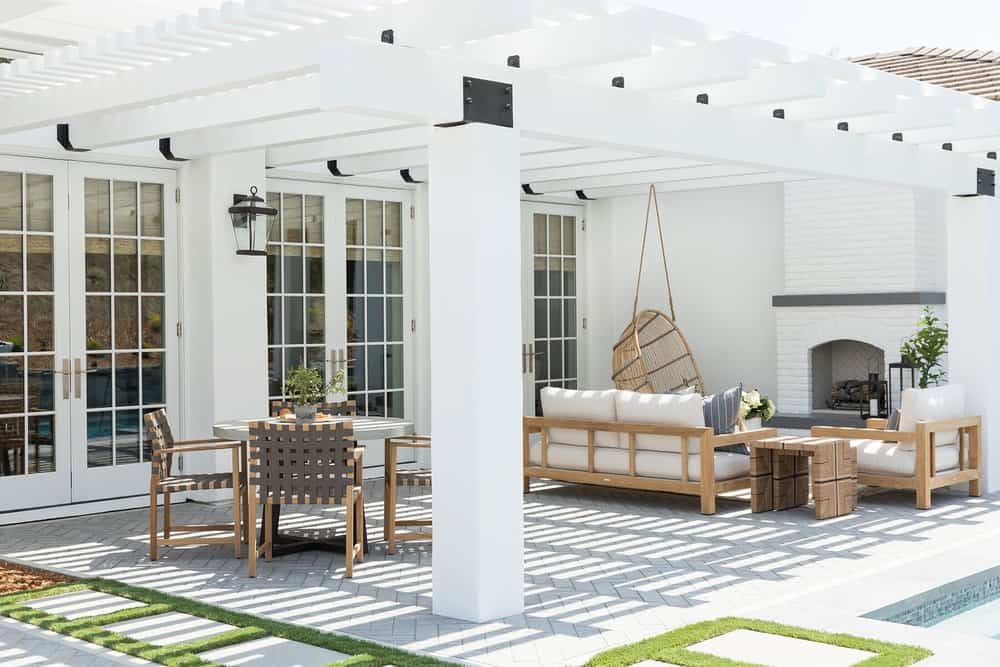 Concrete patio with neutral decor and concrete backyard patio steps.