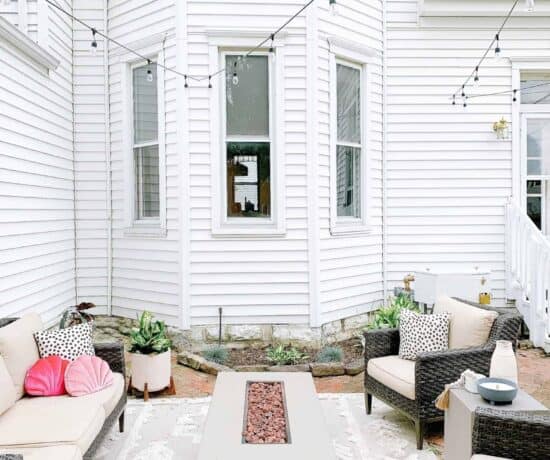 White wooden backyard patio steps leads to our historic 1800s brick pavers.