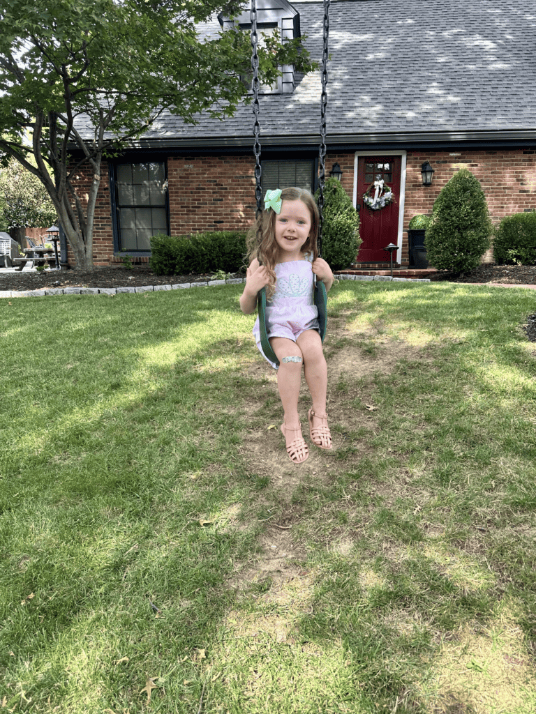 Little girl on a swing