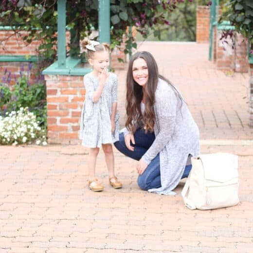 Best bags for moms is tote and backpack combo seen in this picture with mom and little girl