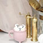 Halloween Coffee Recipes with boo marshmallows hot cocoa in a pink cauldron mug