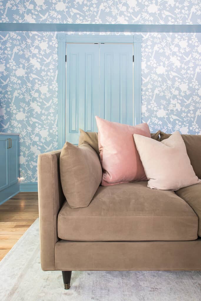 Brown couch in blue room 