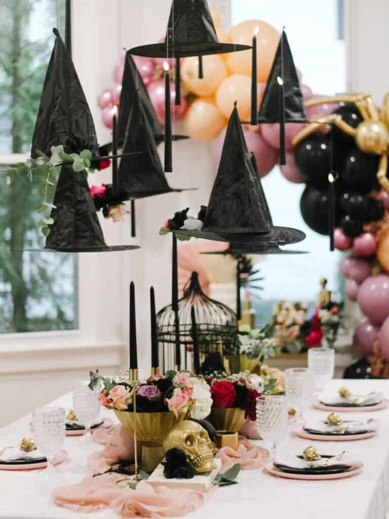 DIY Halloween Decorations hanging witch hats.