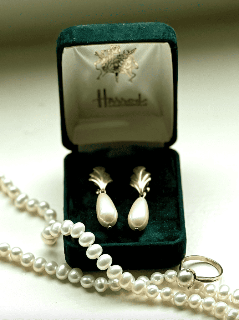 Large pearl earring sizes with necklace and ring.