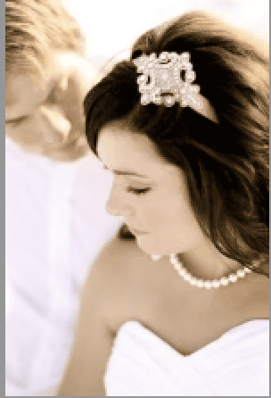 Bride on her wedding day wearing pearls.