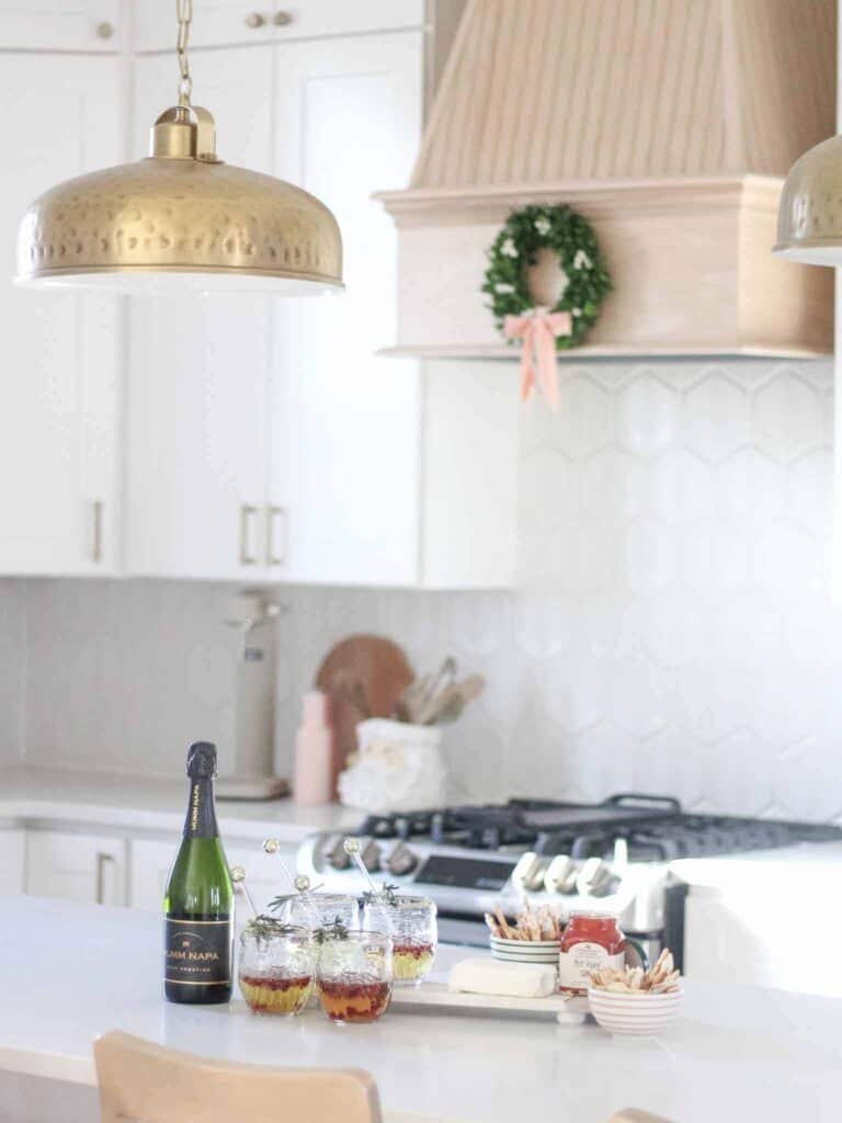 white kitchen with wine and charcuterie spread